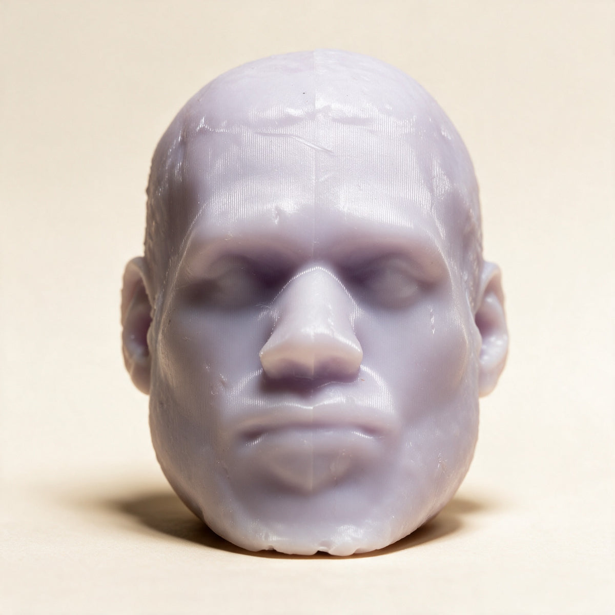 LeSoap Lavender sculpted head soap, front view on a cream background