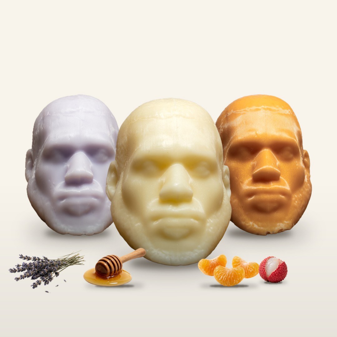 All three LeSoap scents side by side: Lavender, Honey and Tangerine Lychee, with lavender, honey and fruit in front