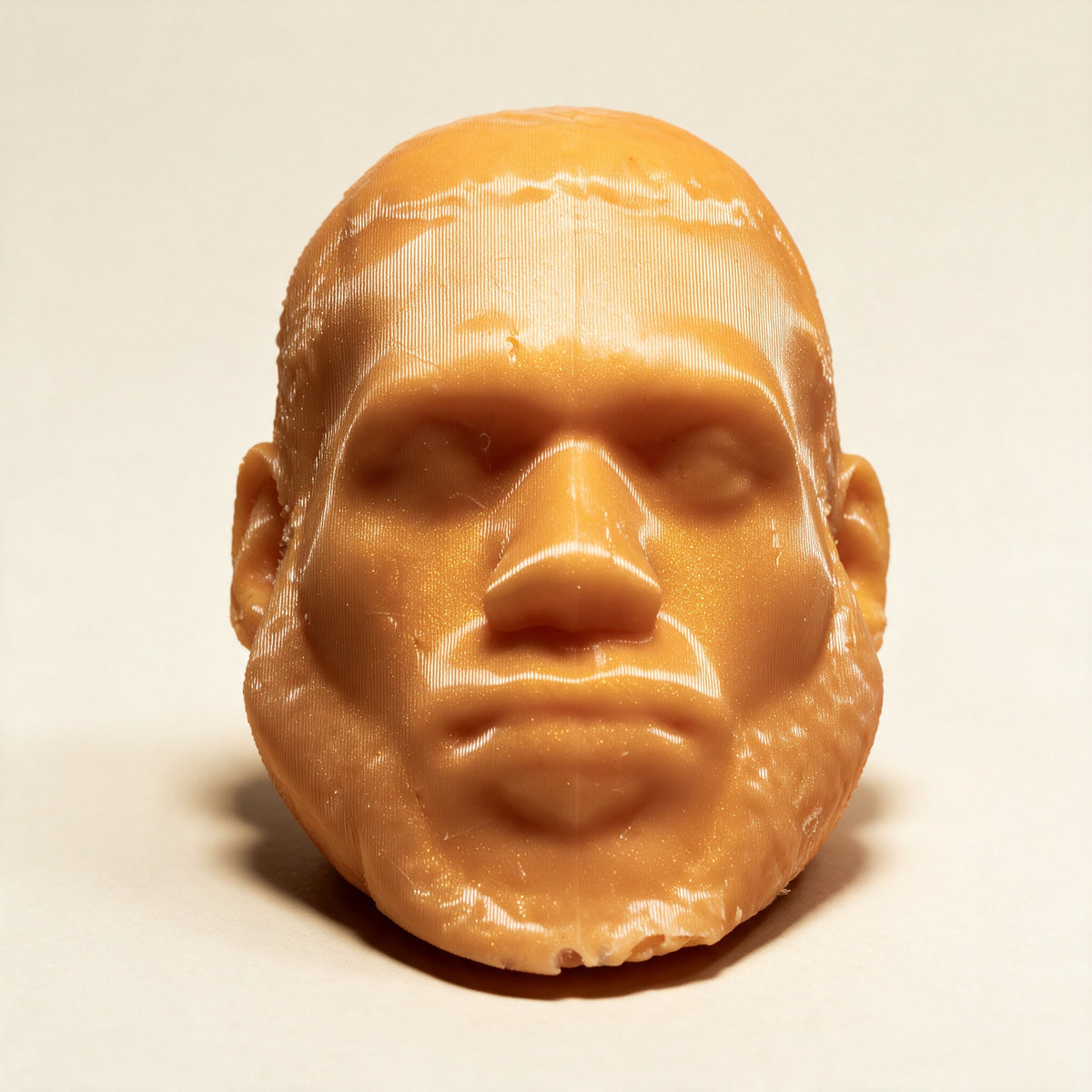LeSoap Tangerine Lychee sculpted head soap, front view on a cream background